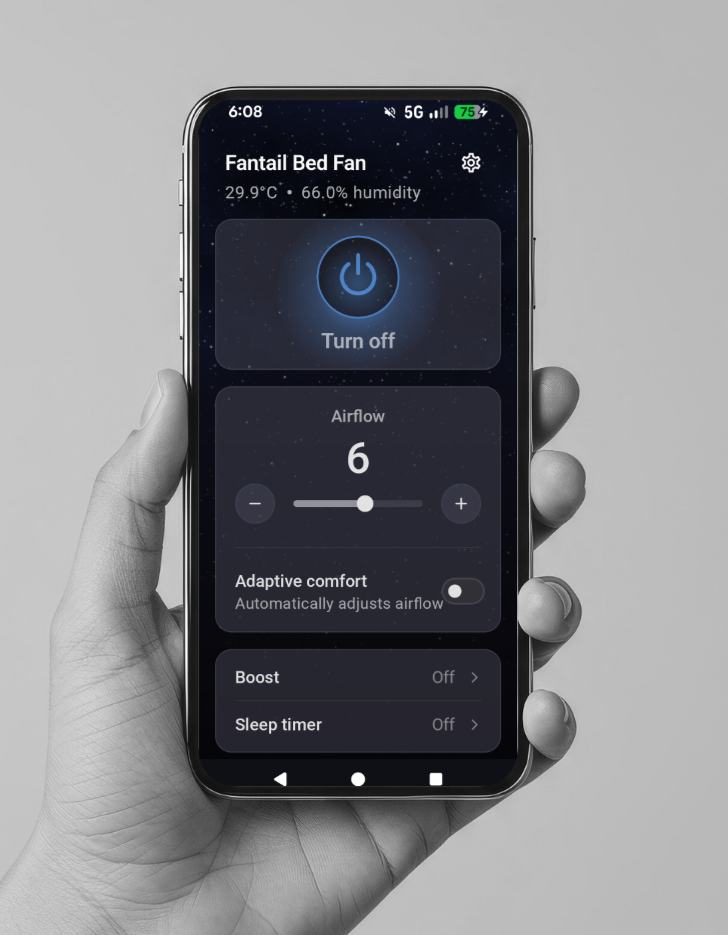 Hand holding a smartphone displaying a fan control app on a gray background